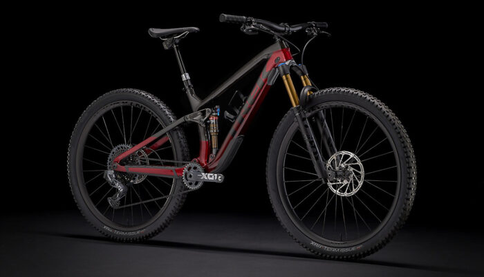 Trek Fuel EX 9.9 X01 AXS (Raw Carbon-Rage Red) black background